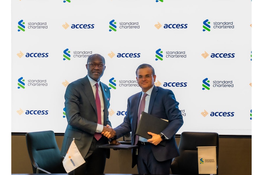 Standard Chartered's Regional CEO, Africa and Middle East, Sunil Kaushal, and Access Bank Plc Group Managing Director , Roosevelt Ogbonna,